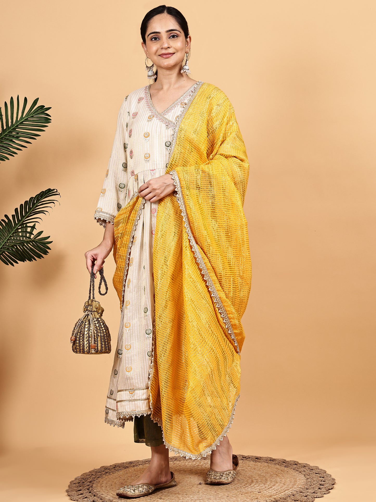 Cream Anarkali-style kurta set with Contrast Mustard Dupatta