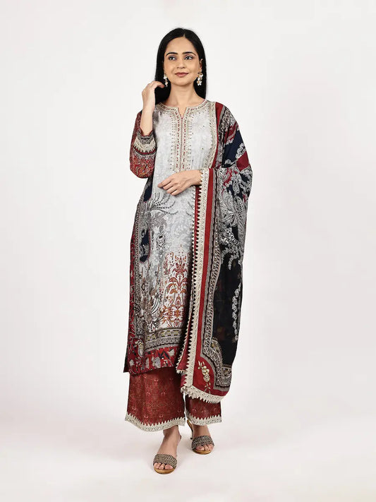 Woman wearing a traditional outfit with a white and red patterned dupatta on a white background