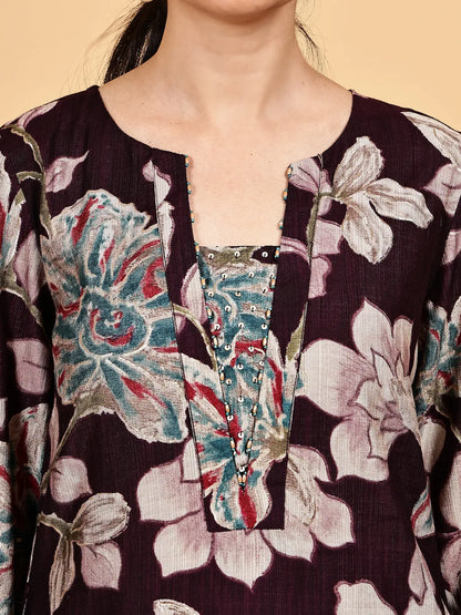 Close-up of a floral patterned garment with a beige background