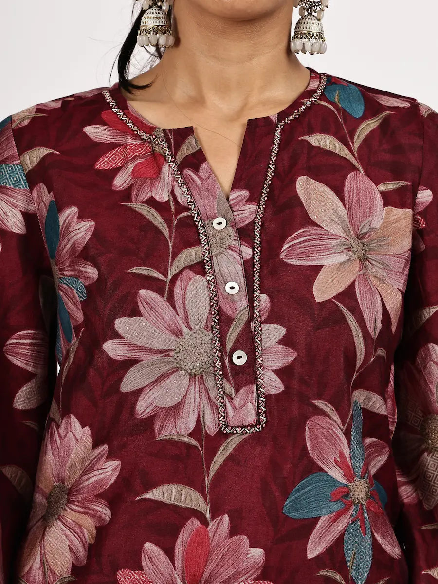 Maroon floral kurta with silver buttons and embroidery on a plain background