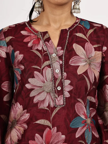 Maroon floral kurta with silver buttons and embroidery on a plain background