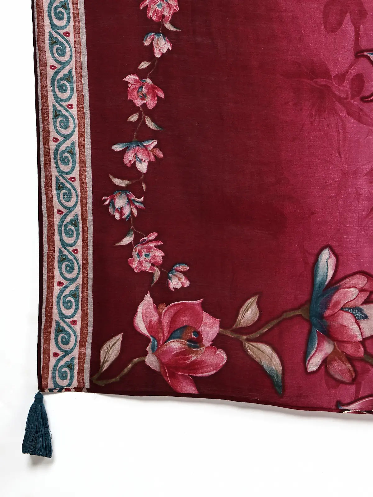 Floral embroidered fabric with a tassel on a white background